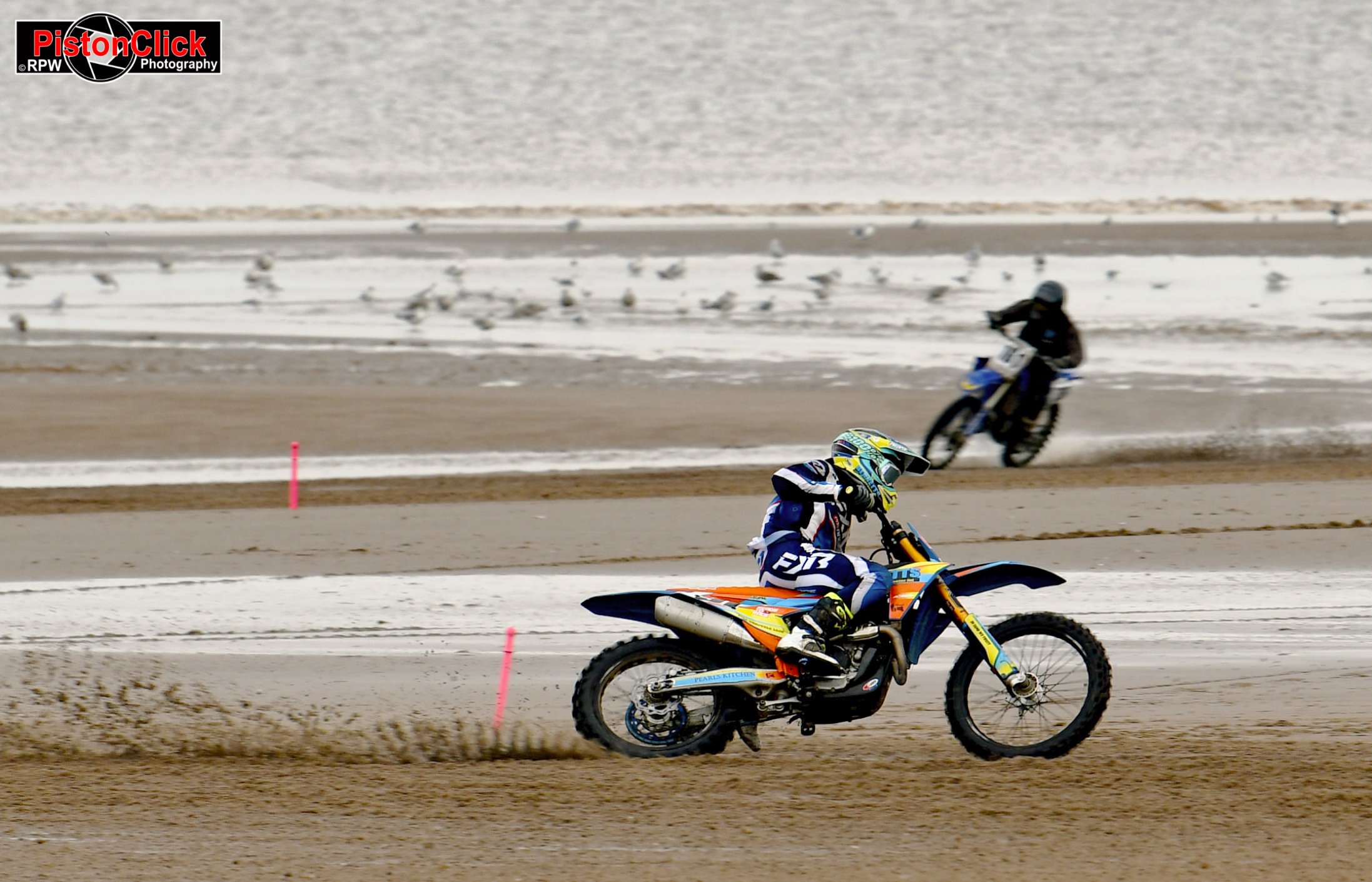 Riders racing on the sand at the Beach Motorcycle Racing Mablethorpe